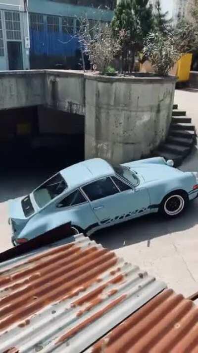 Just a 911 Carrera RS 3.0 drifting out of an underground garage