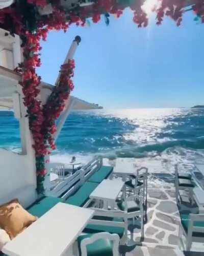 Some places have 'ocean-view dining'. Then there's this restaurant in Mykonos, Greece....