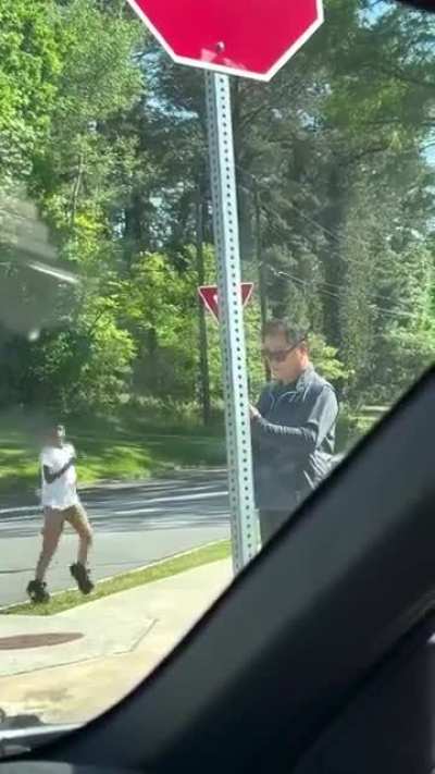 A woman driving by spotted a man behaving suspiciously with two kids and intervened.