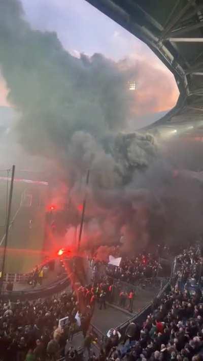 No the stadium is not on fire during a Feyenoord football match (soccer)