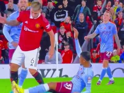 Bailey kicks out at Martinez. No red card