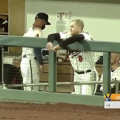 Reno Aces skipper simulates the umpiring at home plate during his ejection