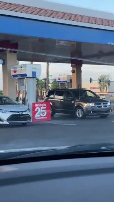 Woman drives 2 miles to fill her car. Doesn't leave the gas station.