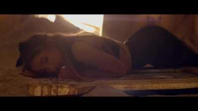 Arching to accentuate her assests