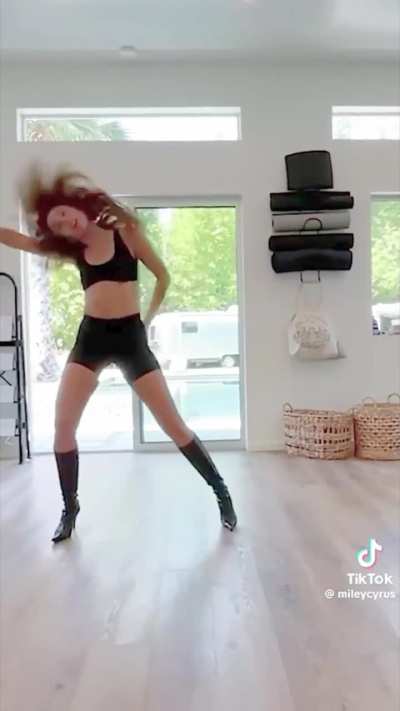 Miley doing her homework.