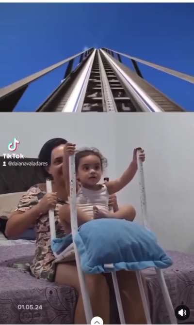 Mom gives her best to entertain her daughter.