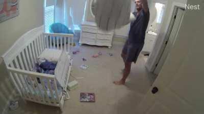 Swinging baby in bedsheet
