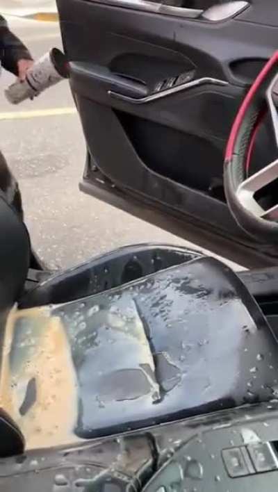 Pressing a paper cup full of coffee