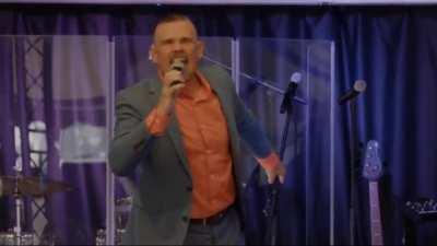 Insane antivaxx televangelist screams at his congregation 