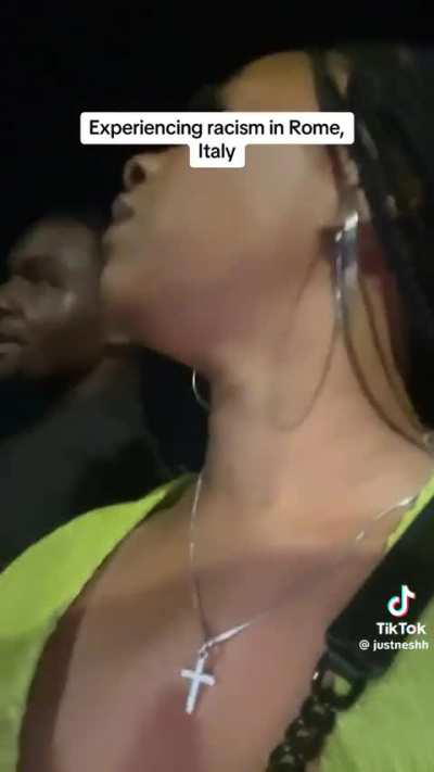 Racist Luigi and Chiara prevent tourists from graffitiing a bridge in Rome.