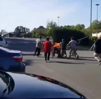 Sucker puncher gets mobbed by skateboarders. Reminds me of that scene in the movie 