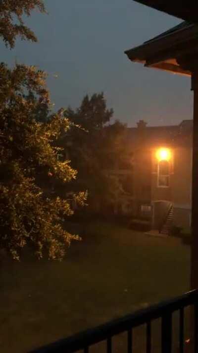 Storming in Texas tonight, with a lightning strike behind my building [WARNING: loud sound]