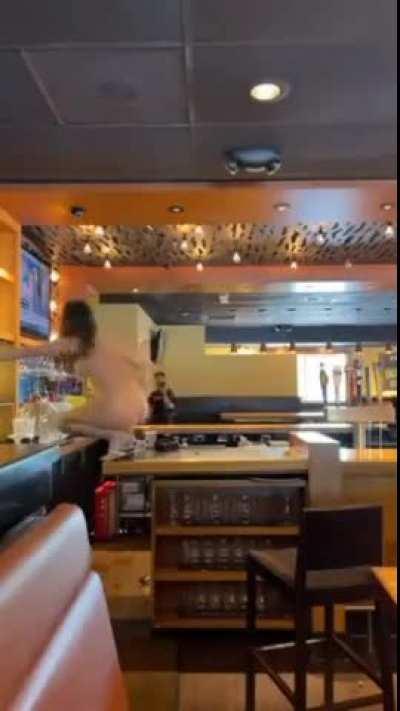 Crazy naked girl destroys bar