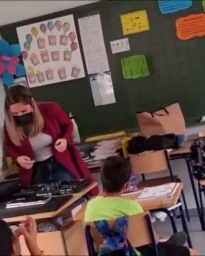 Teacher spreading positive and educational messages through house music to her class