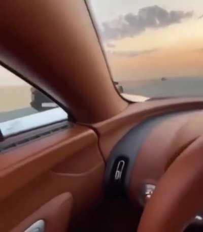 Racing in the sunset with a Bugatti