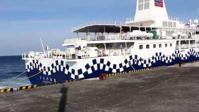 A ferry in Japan, trying to dock