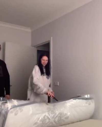 WCGW Unwrapping a rolled bed indoors