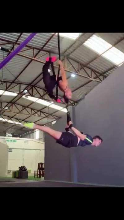 There's so much going on in this gif. One thing for certain is that someone is hanging by their hair.