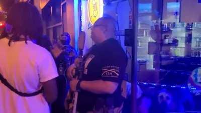 Louisville protesters confront a Hispanic man guarding his business and ask him a series of questions to see if he supports black lives matter