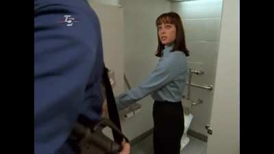 Melinda Clarke Kicks Henchman in the Balls for not Giving her Privacy in the Ladies Room. Soldiers of Fortune Inc (1997)