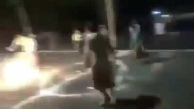 Playing soccer with a flaming ball .