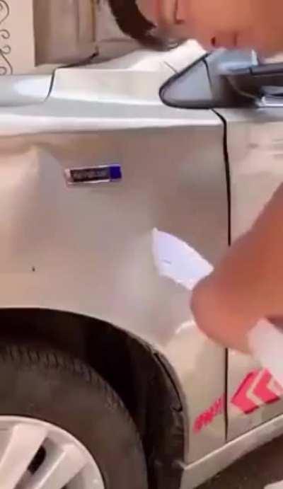 WCGW trying to fix a dent with hot glue