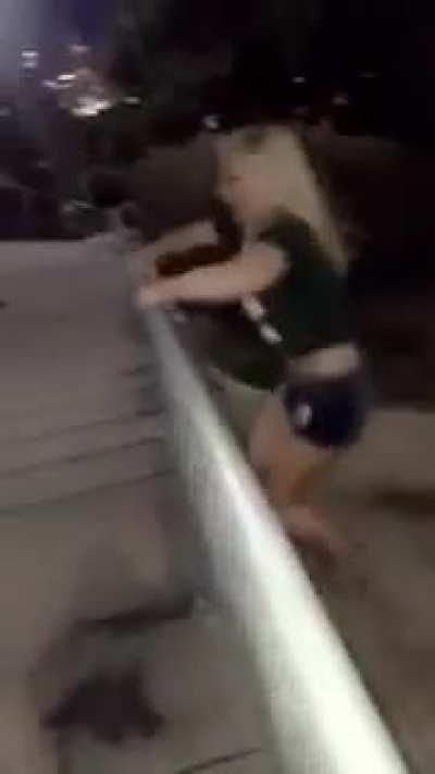 Girl Jumping Over Fence..............