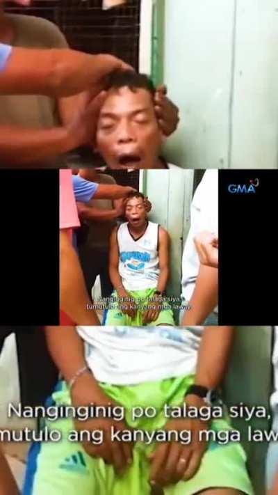 A man played with a dead King Cobra's head.