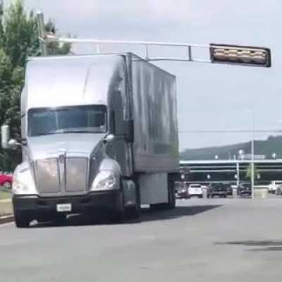 Swift driver picks up the traffic light in his cab.