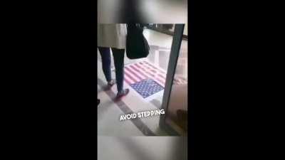 Iranian students refuse to step on American flag
