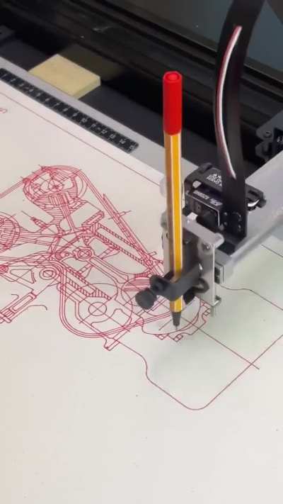 Robot drawing an engine blueprint