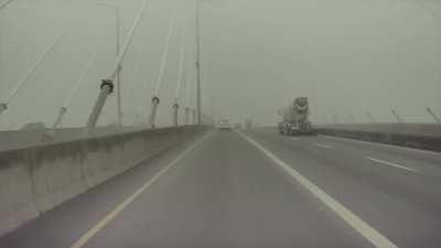 Man narrowly misses being struck by cement truck on Port Mann Bridge in Vancouver