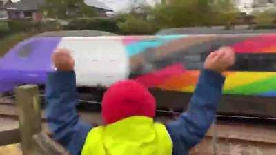 Kid seeing 'The Pride One' train for the first time