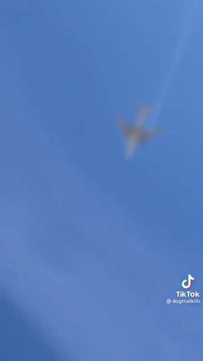 Plane flies over a house with a blown engine