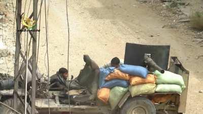 Cannibalized BMP cannon placed on a sandbagged and stripped truck used in Syria
