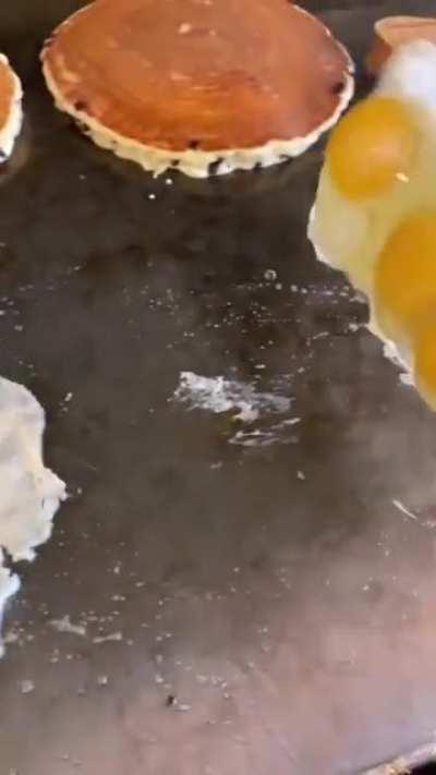 Wait, WUT?? Flipping pancakes and EGGS.
