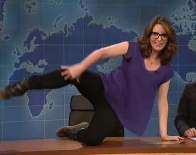 Tina gets on the desk and shows off her moves