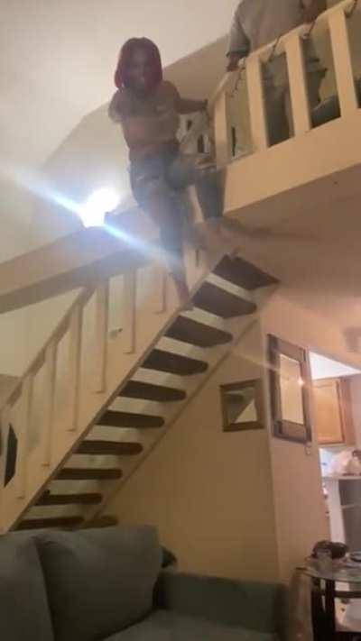 Trying to jump on the sofa from the stairs