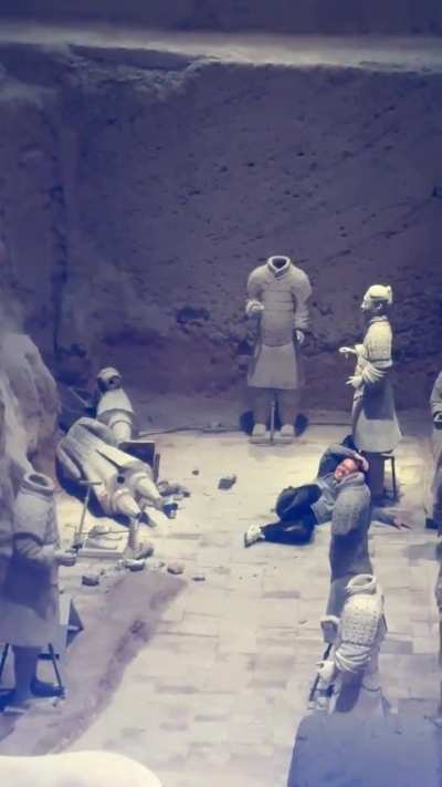 Chinese tourist jumped into the pit at the Terracotta Army Mausoleum Museum in Shaanxi and pushed over two of the 2000 year old statues