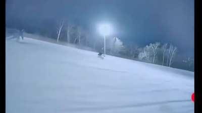 Batman and Joker chase on snowboard and ski