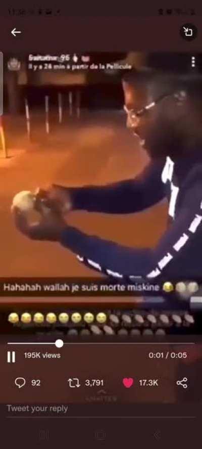 Guy let's off firework in front of face in two different perspectives.