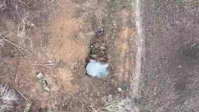 Large group of Russian soldiers in a ditch are hit with drone dropped grenade, Bahmut