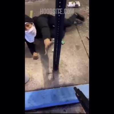 Asian store owner holds looter at gunpoint