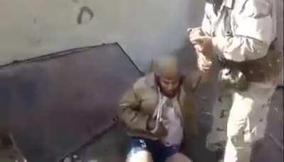 kurdish peshmerga with an captured isis sniper (this was back in 2016)