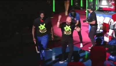 [Highlight] Joel Embiid makes his entrance with WWE's Triple H, who rings the starting bell for the 76ers
