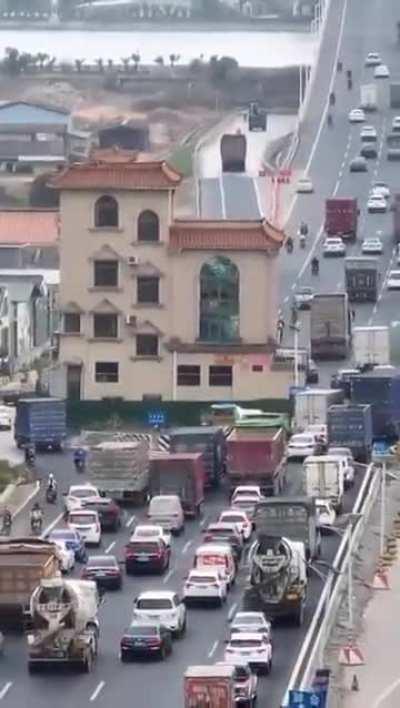 A house in the middle of the street.