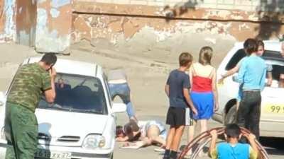 Russian girls, looks like one of them takes out a tire iron.