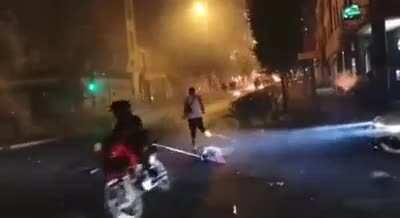 Dude casually dragging a chainsaw with his bike