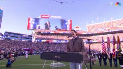 The way the cameraman smoothly tracks the jets and lands perfectly back on the singer