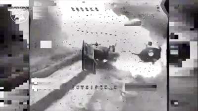 A Russian BMP-2 explodes upon hitting an anti-tank mine just as a Ukrainian FPV drone is flying at it